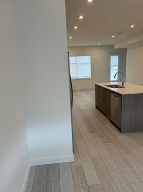 Calgary house for rent - A kitchen with a sink and a window.