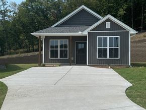 Little Rock house for rent - A gray house with a black door and windows.