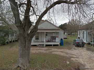 El Campo house for rent - A tree in front of a white house.