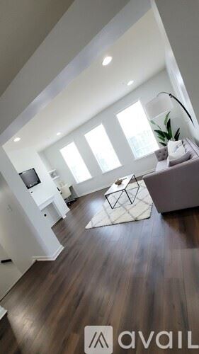 Capitol Heights apartment for rent - A living room with a white couch and a television.