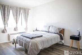 Sierra Vista apartment for rent - A bedroom with a large bed and a nightstand.