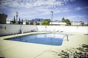 Sierra Vista apartment for rent - A pool with a blue water and a white wall.