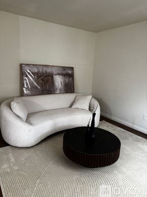 Sierra Vista apartment for rent - A living room with a couch, chair, coffee table, and television.