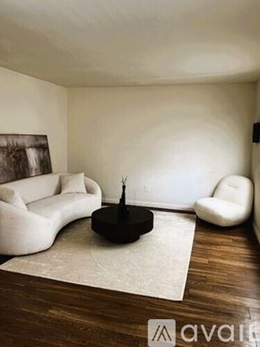 Sierra Vista apartment for rent - A kitchen with a white fridge, black cabinets, and a white dishwasher.
