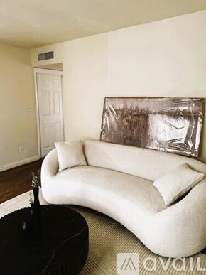 Sierra Vista apartment for rent - A kitchen area with a white refrigerator and wooden flooring.