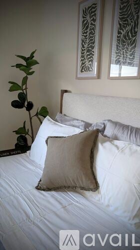 Sierra Vista apartment for rent - A living room with a black couch and a wooden floor.