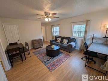 Asheville apartment for rent - A kitchen with white cabinets and a sink.