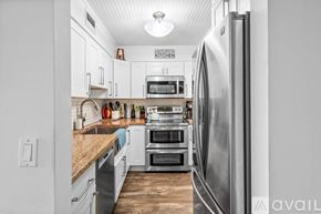 Delray Beach condo for rent - A kitchen with a refrigerator on the right side.