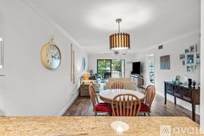 Delray Beach condo for rent - A dining room with a table set for four.