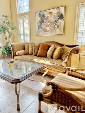 San Dimas townhouse for rent - A modern dining room with a glass table and chairs.
