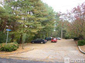 Dalton apartment for rent - A street with cars parked on the side and a sign that says "Avail".
