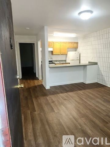 Dalton apartment for rent - A kitchen with a white stove and a white sink.