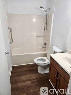 Dalton apartment for rent - A bathroom with a toilet, sink, and bathtub.