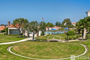 Carlsbad apartment for rent - A park with a bridge and a pool in the background.