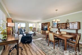 Carlsbad apartment for rent - A well-lit dining room with a wooden table and chairs.
