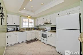 Carlsbad apartment for rent - A kitchen with white appliances and cabinets.
