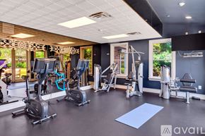 East Moriches apartment for rent - A gym with a variety of equipment including treadmills, stationary bikes, and weight machines.