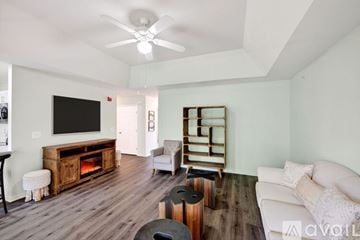 East Moriches apartment for rent - A living room with a white couch and a wooden floor.