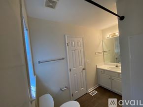 Raleigh apartment for rent - A living room with a fireplace and a couch.