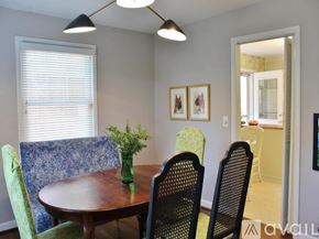 Charleston house for rent - A dining room with a table and chairs.