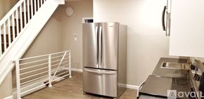 Philadelphia house for rent - A kitchen with a stainless steel refrigerator and a sink.