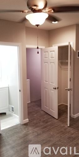 Philadelphia house for rent - A room with a ceiling fan and a door.