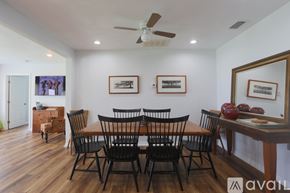 Winter Haven house for rent - A dining room with a wooden table and chairs.