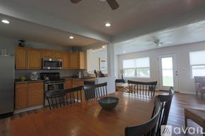 Winter Haven house for rent - A modern kitchen with wooden cabinets and a large island.