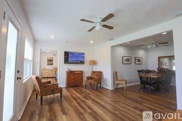 Winter Haven house for rent - A living room with a television and a dining table.