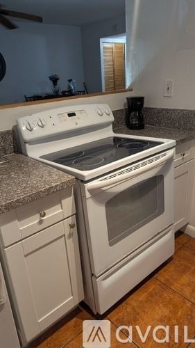 Miami apartment for rent - A living room with a grey couch and a black coffee table.