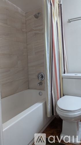Miami apartment for rent - A kitchen with white cabinets and a granite countertop.