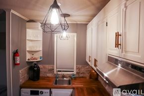 Weston apartment for rent - A bedroom with a bed, chair, and wardrobe.