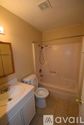 Corpus Christi apartment for rent - A bathroom with a toilet, sink, and bathtub.