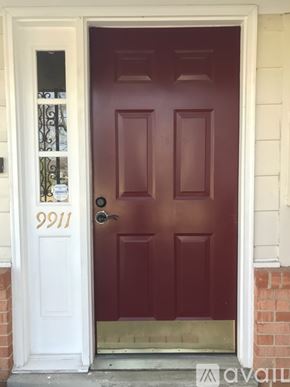 Fairfax house for rent - A red door with the number 9911 on it.