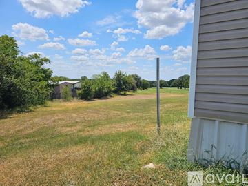 Azle house for rent - A kitchen with a counter and a fan.