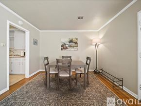 Tulsa house for rent - A dining room with a table and chairs.