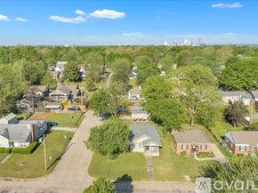 Tulsa house for rent - A bird's eye view of a residential area with houses and trees.