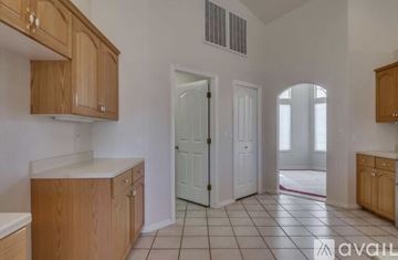 Santa Clara apartment for rent - A kitchen with wooden cabinets and a white countertop.