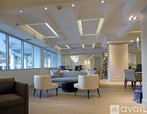 Miami Beach condo for rent - A living room with a Christmas tree and a couch.