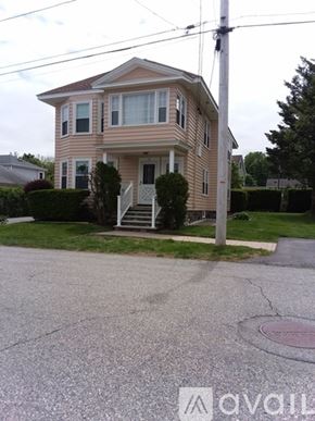 North Andover apartment for rent - A two-story house with a front porch and a driveway.