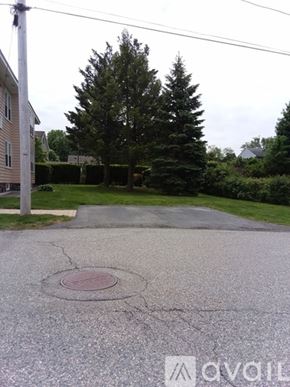 North Andover apartment for rent - A tree is in the background of a driveway.