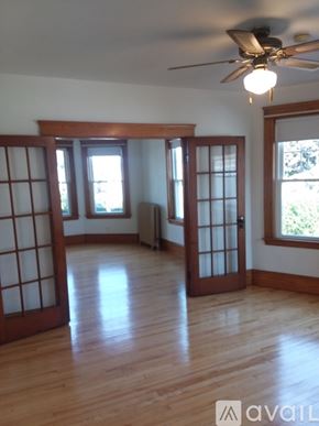 North Andover apartment for rent - A room with wooden floors and a ceiling fan.