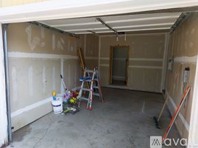 Cheney townhouse for rent - A room with a window and wooden flooring is available for rent.