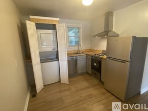 Nashville apartment for rent - A kitchen with a refrigerator, oven, and sink.