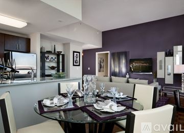 Jersey City apartment for rent - A modern dining room with a glass table set for six.