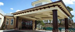 Norwalk apartment for rent - A house with a covered entrance and a balcony.