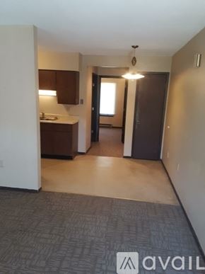 Delphos apartment for rent - A carpeted hallway with a logo that says "avaiL" on the floor.