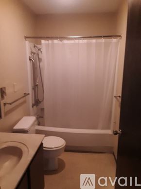 Delphos apartment for rent - A bathroom with a toilet, sink, and shower.