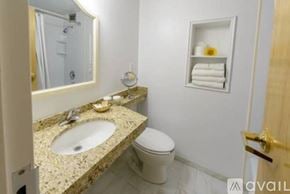 Norwalk apartment for rent - A bathroom with a sink, toilet, and mirror.