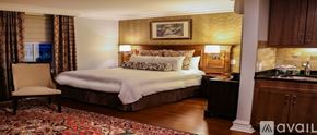 Norwalk apartment for rent - A bedroom with a large bed and a chair.